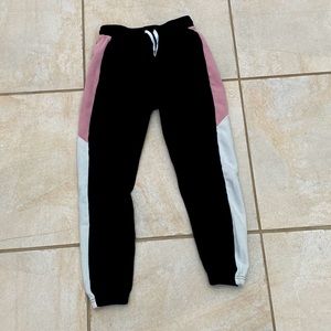 Black sweat pants with pink and white stripes